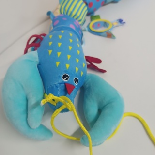 Zabawka sensoryczna dla dzieci, pluszowa, antystresowa, grająca, kolorowy krab